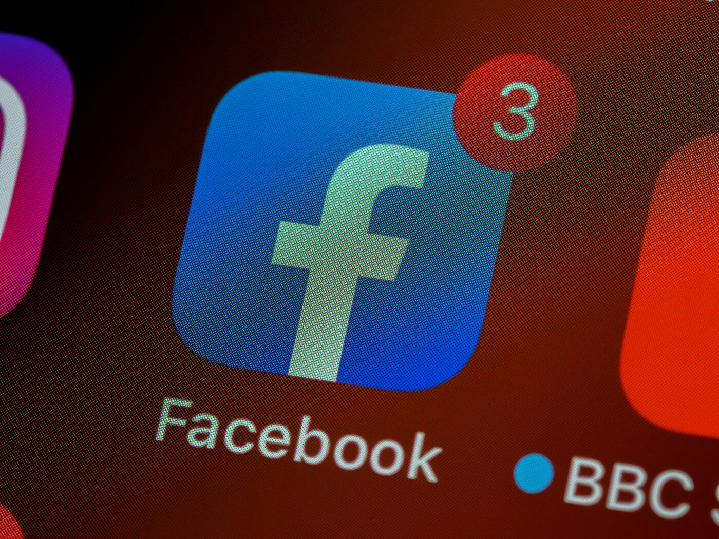 A close-up shot of an iPhone Facebook app icon